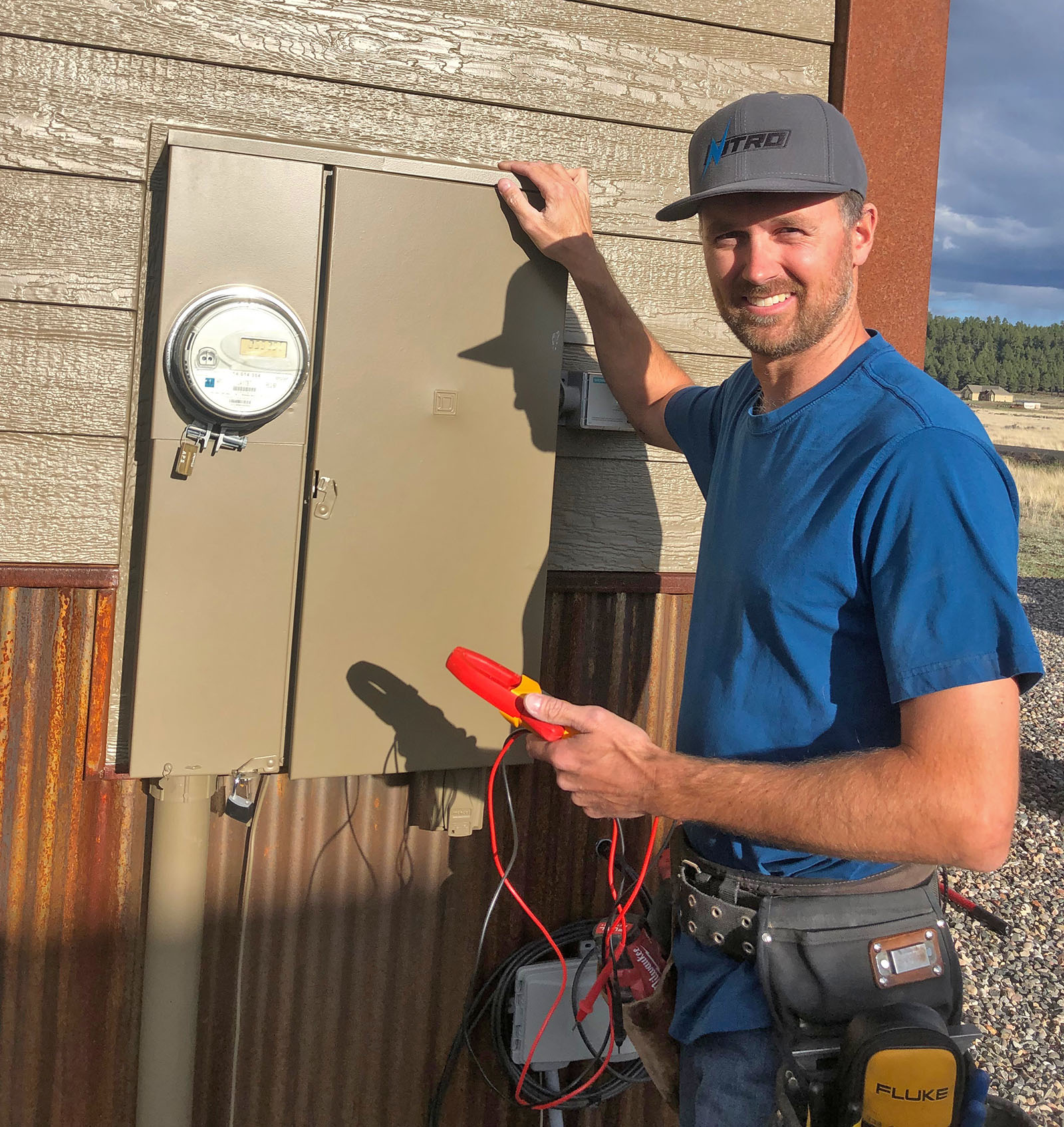 Electrican working on a residential power meter in Flagstaff